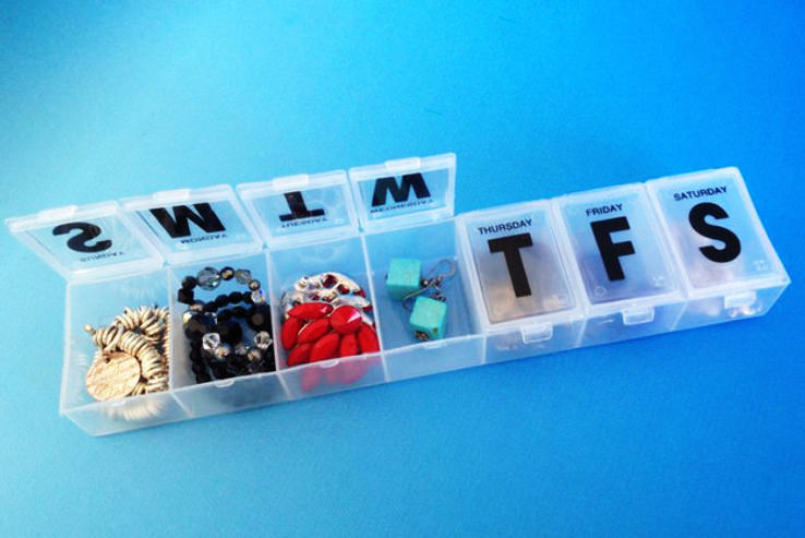 Use pill containers to store and sort your jewelry.